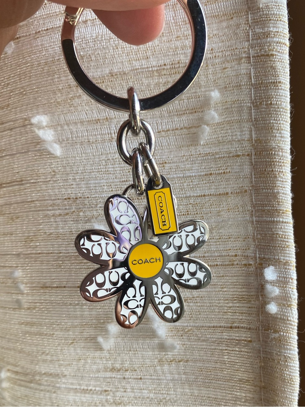 Coach Silver Daisy Keychain with Yellow Tag